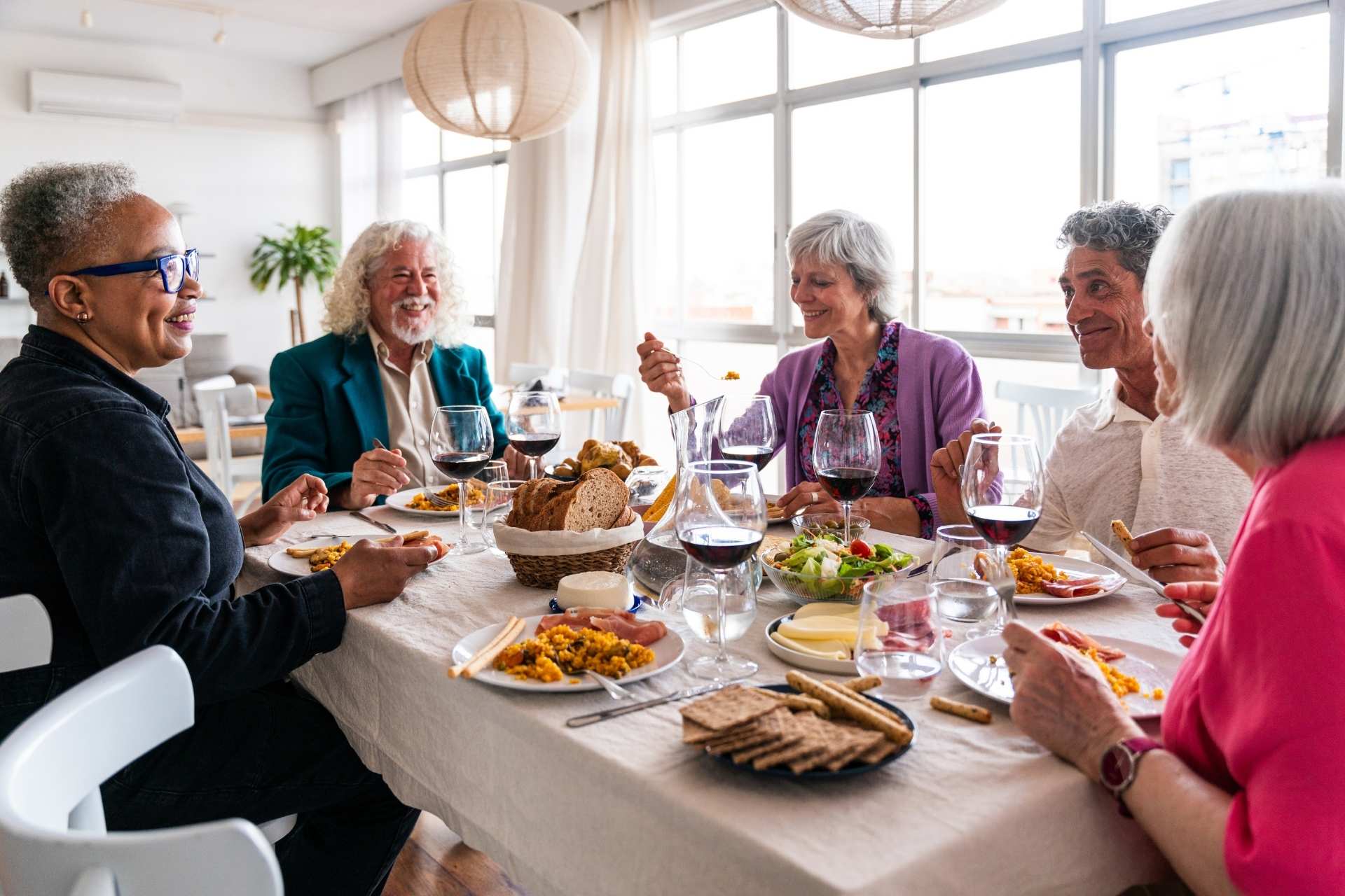 A group of seniors enjoying a meal together.